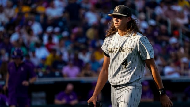 Wake Forest Demon Deacons starting pitcher Rhett Lowder (4) walks off the field at the end of the first inning against the LSU Tigers at Charles Schwab Field Omaha.